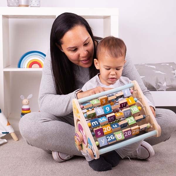 Bigjigs Toys Wooden Triangular Activity Centre - McGrocer